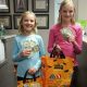 Two children participating in Operation Gratitude Candy Buy Back at Lydiatt and Duru Family Dentistry.